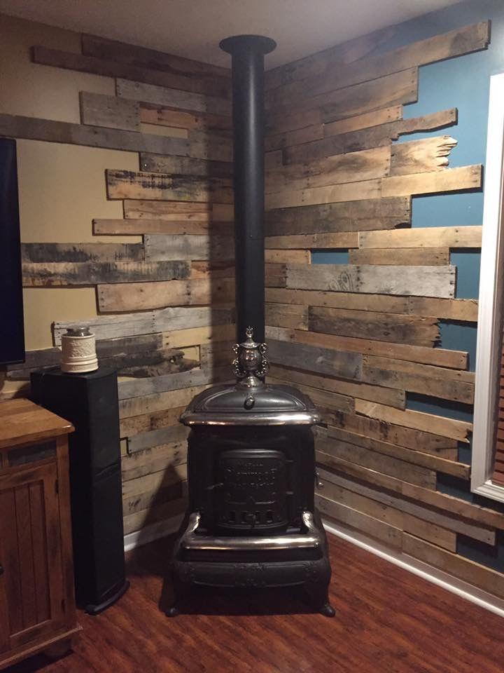 Wood stove with pallet wall | Wood stove wall, Corner wood stove, Wood stove fireplace