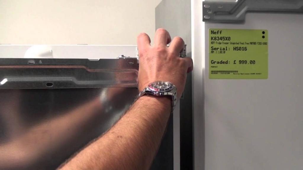 How to re hinge the door on an Integrated fridge freezer - YouTube