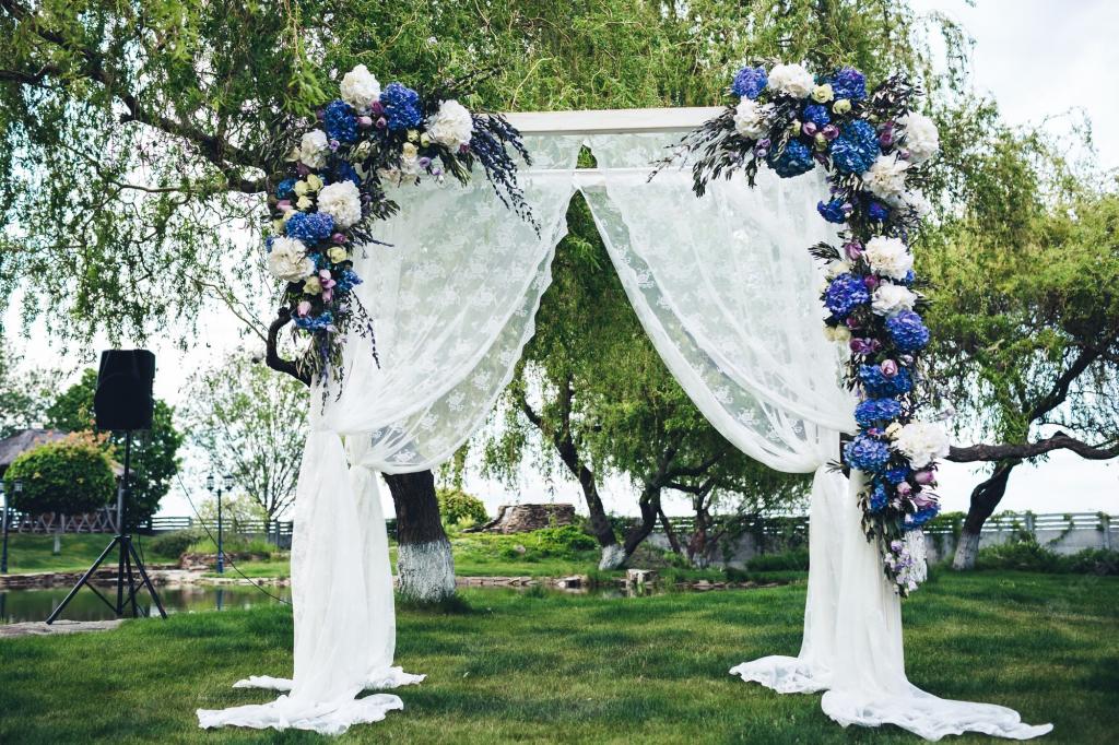 Premium Photo | Wedding arch decorated with fabric and flowers.