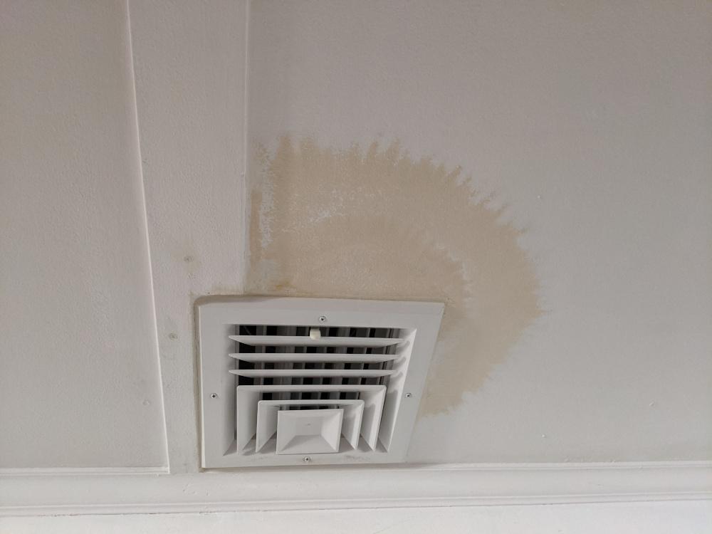 air conditioning - Why is the paint around my ceiling air vent discolored? - Home Improvement Stack Exchange